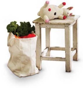 Wayne's Flooring - Rustic interior design tips - wooden stool, stuffed animal, canvas bag